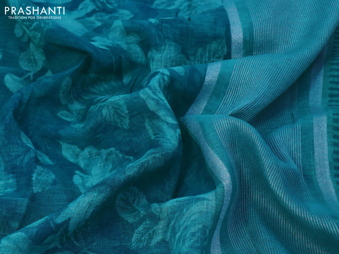 Pure linen saree teal blue with allover prints and silver zari woven piping border