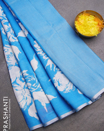 Pure linen saree light blue with allover floral prints and silver zari woven piping border