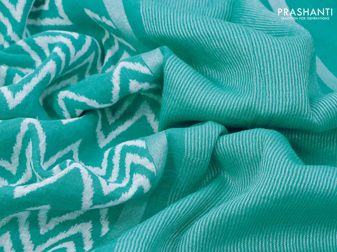 Pure linen saree teal blue with allover zig zag prints and silver zari woven piping border