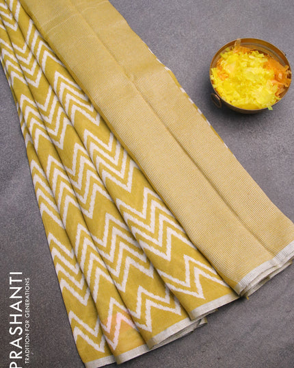 Pure linen saree lime yellow with allover zig zag prints and silver zari woven piping border