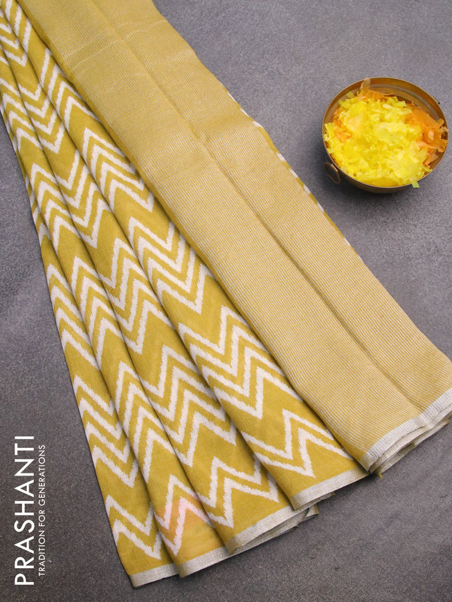 Pure linen saree lime yellow with allover zig zag prints and silver zari woven piping border