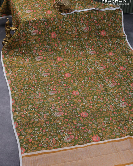 Pure linen saree sap green with allover kalamkari prints and silver zari woven piping border