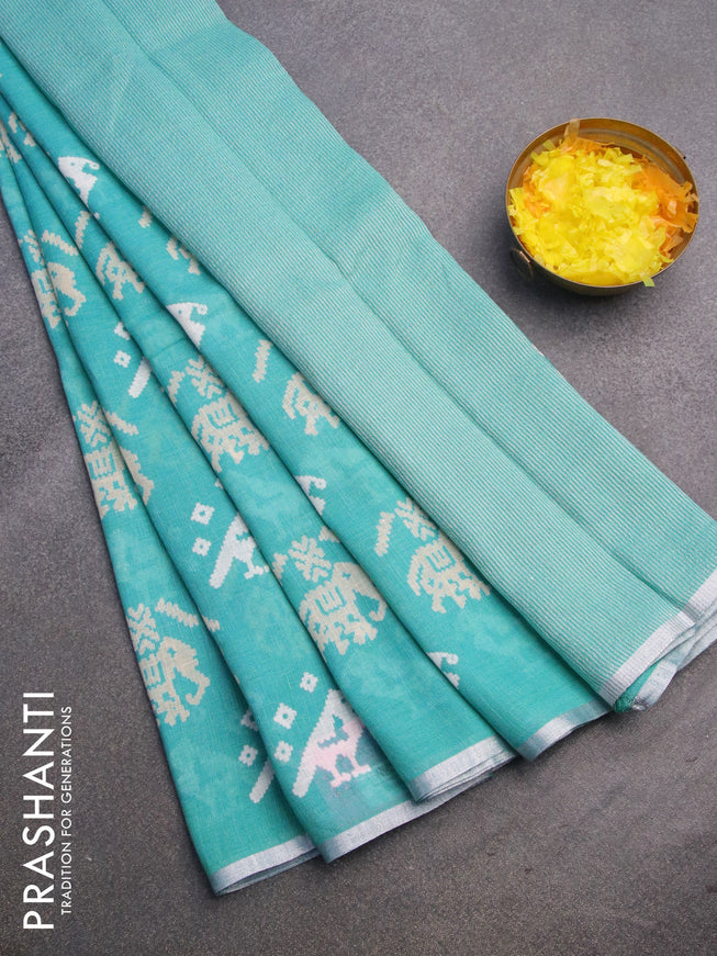 Pure linen saree teal blue with patola prints and silver zari woven piping border