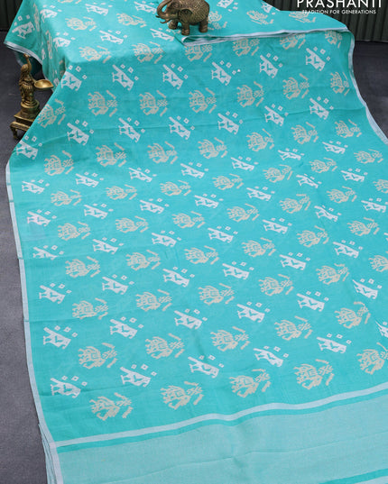 Pure linen saree teal blue with patola prints and silver zari woven piping border