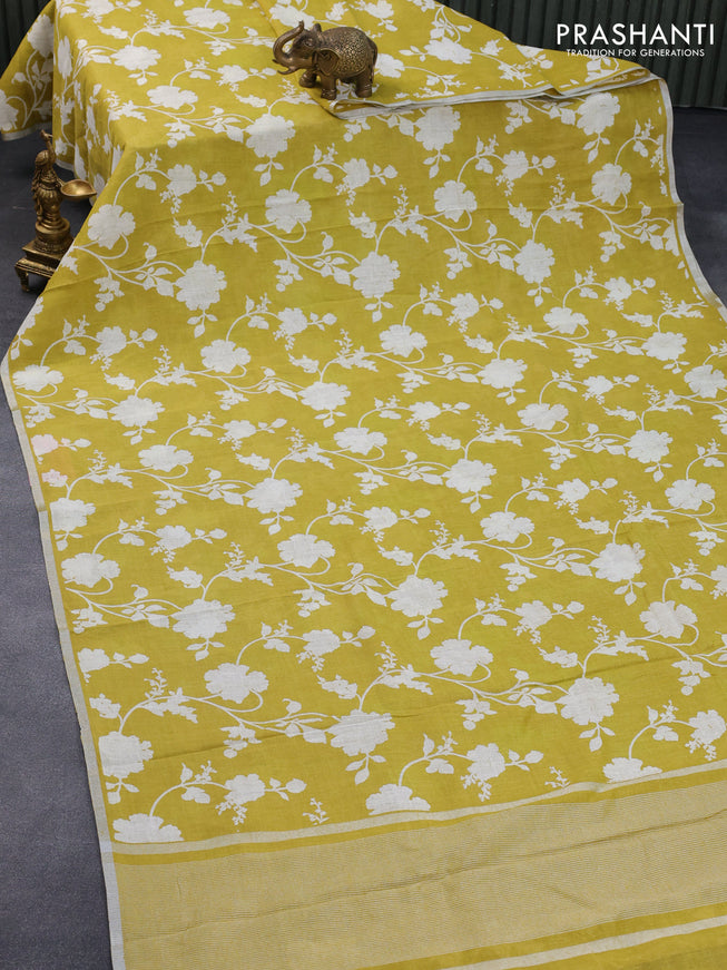 Pure linen saree lime yellow with allover floral prints and silver zari woven piping border