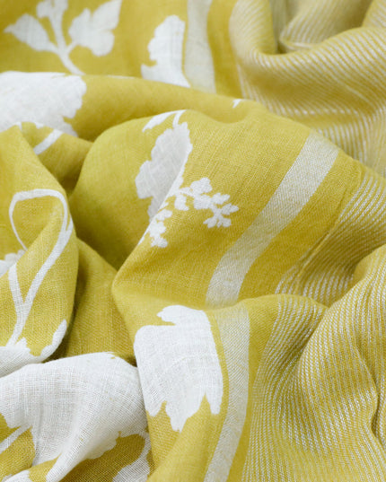 Pure linen saree lime yellow with allover floral prints and silver zari woven piping border