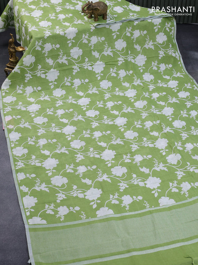 Pure linen saree light green with allover floral prints and silver zari woven piping border