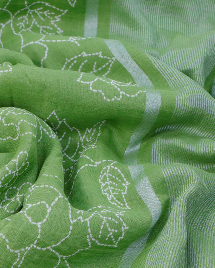 Pure linen saree light green with allover prints and silver zari woven piping border