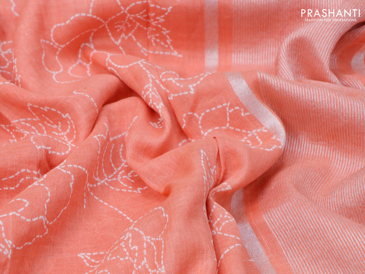 Pure linen saree peach orange with allover prints and silver zari woven piping border