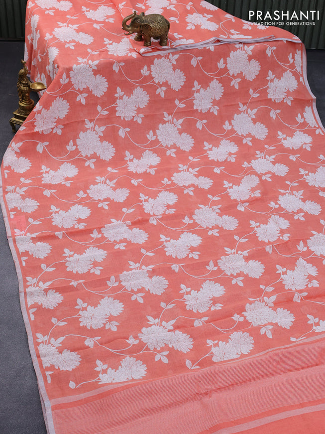 Pure linen saree peach orange with allover floral prints and silver zari woven piping border