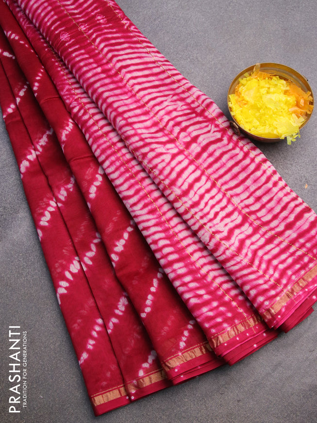 Chanderi bagru saree dark magenta pink with allover shibori prints and zari woven piping border