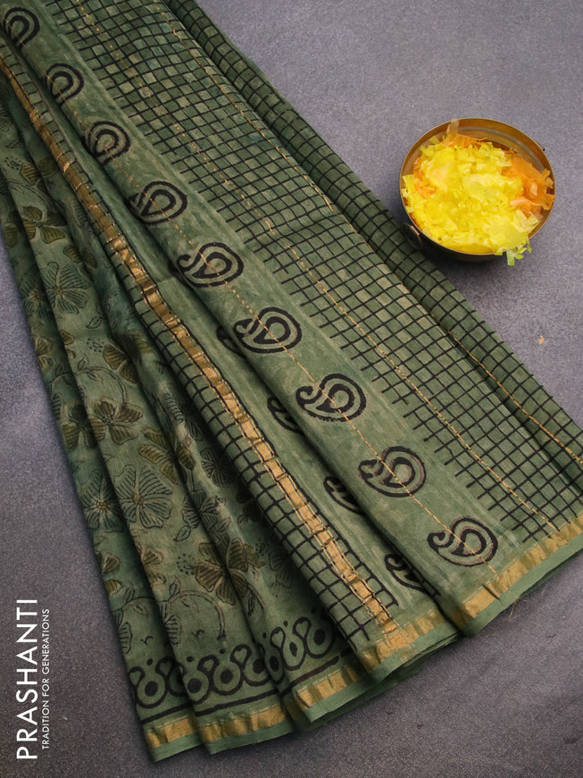 Chanderi bagru saree pastel green with allover floral prints and zari woven piping border