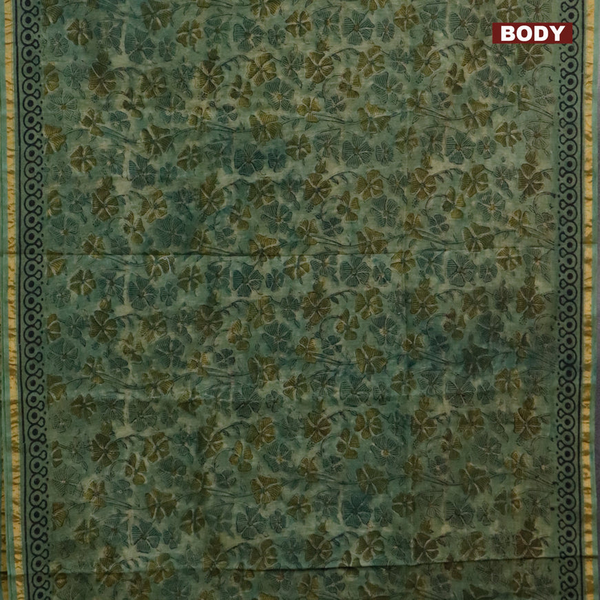 Chanderi bagru saree pastel green with allover floral prints and zari woven piping border