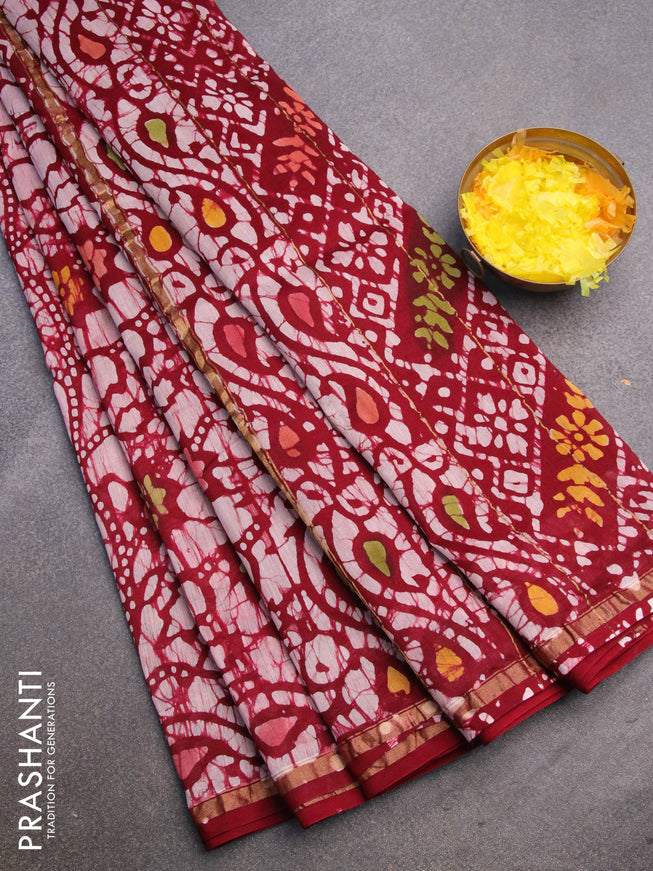 Chanderi bagru saree maroon with allover batik prints and zari woven piping border