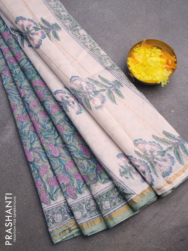 Chanderi bagru saree green shade with allover floral prints and zari woven piping border