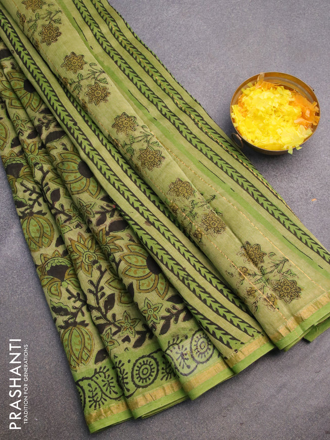 Chanderi bagru saree light green with allover floral prints and zari woven piping border