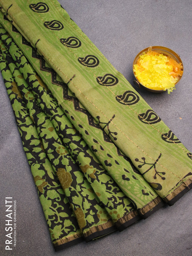 Chanderi bagru saree black and light green with allover floral prints and zari woven piping border