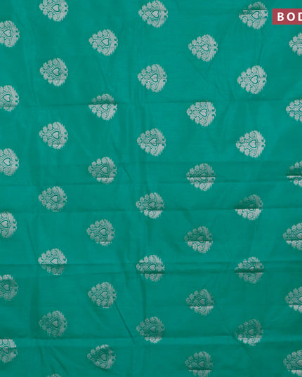 Semi raw silk saree teal green with silver zari woven buttas and silver zari woven border