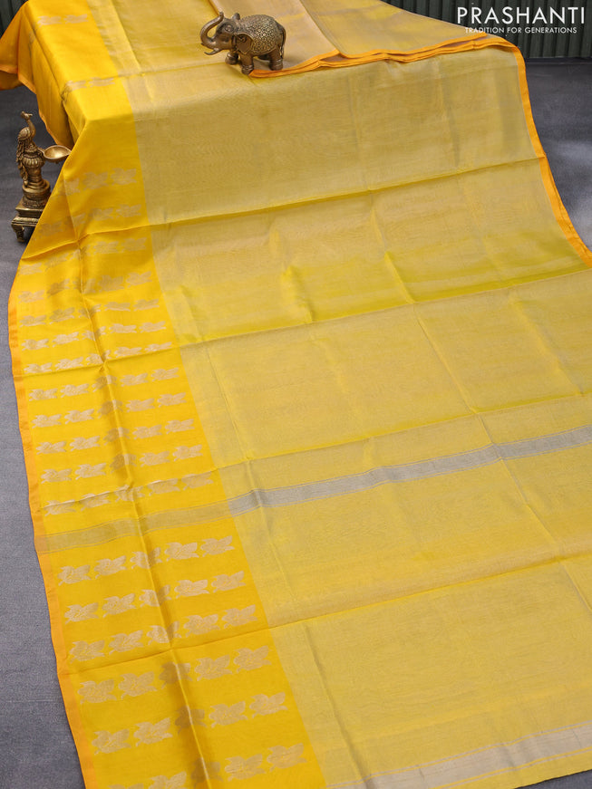 Pure uppada tissue silk saree yellow shade and mango yellow with plain body and long silver zari woven leaf butta border