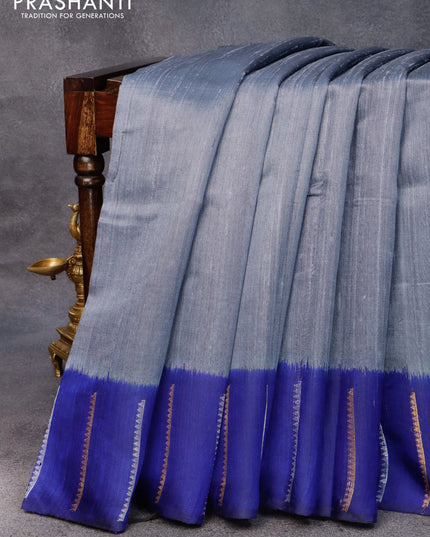 Pure dupion silk saree grey and blue with plain body and zari woven border