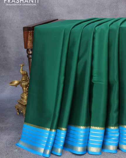 Pure mysore crepe silk saree dark green and cs blue with plain body and zari woven border