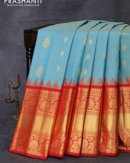 Pure gadwal silk saree pastel blue and red with zari woven buttas and temple design long zari woven border