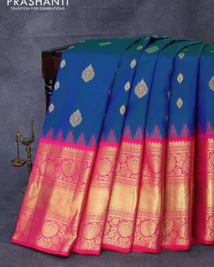 Pure gadwal silk saree dual shade of bluish green and pink with zari woven buttas and temple design long zari woven border