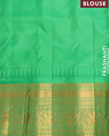 Pure gadwal silk saree light pink and light green with zari woven buttas and temple design zari woven border