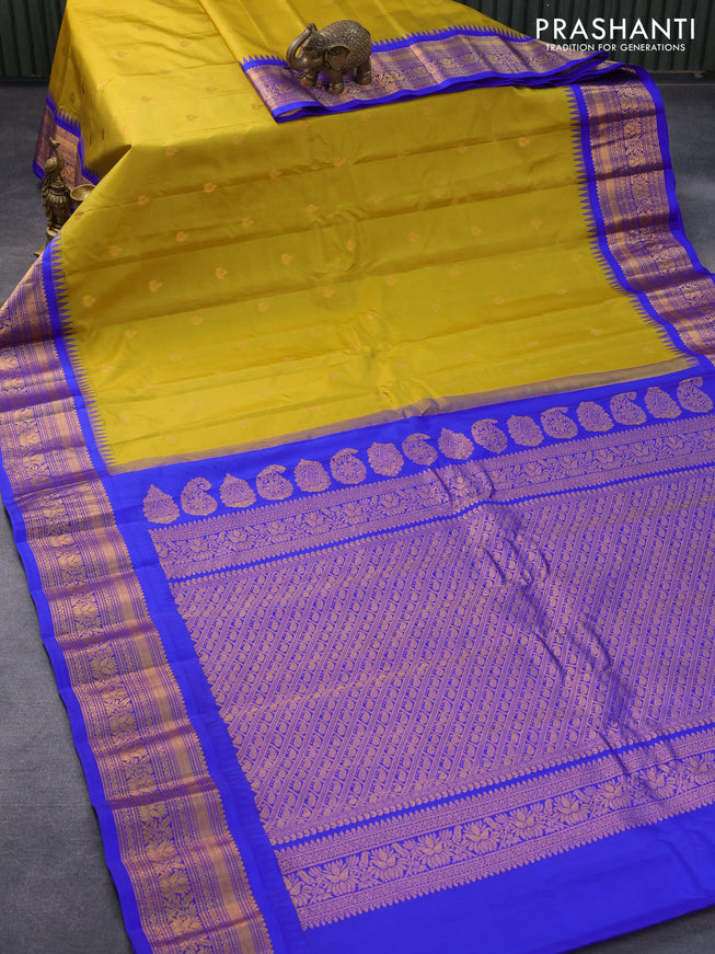 Pure gadwal silk saree mustard shade and royal blue with zari woven buttas and temple design zari woven border