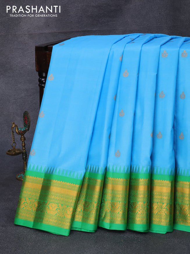 Pure gadwal silk saree light blue and light green with zari woven buttas and temple design zari woven border