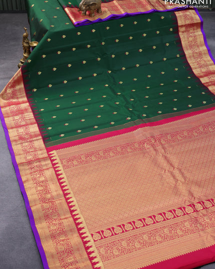 Pure gadwal silk saree green and dark pink with zari woven buttas and temple woven zari border