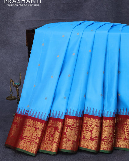 Pure gadwal silk saree light blue and maroon with zari woven buttas and temple design zari woven floral border