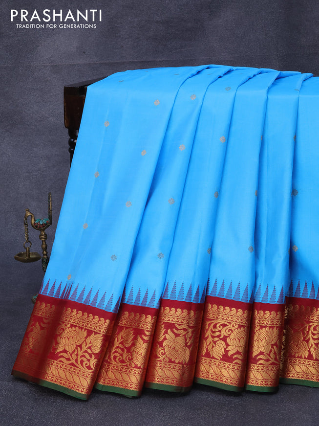 Pure gadwal silk saree light blue and maroon with zari woven buttas and temple design zari woven floral border