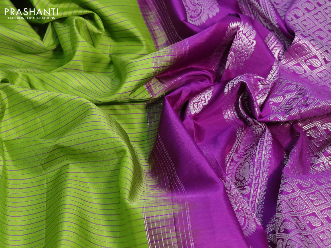 Pure gadwal silk saree light green and deep purple with allover stripes pattern and temple design rettapet silver zari woven border