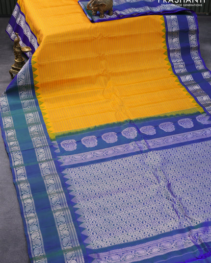 Pure gadwal silk saree mango yellow and dual shade of bluish green with allover stripes pattern and temple design rettapet silver zari woven border