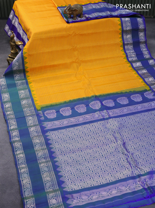 Pure gadwal silk saree mango yellow and dual shade of bluish green with allover stripes pattern and temple design rettapet silver zari woven border