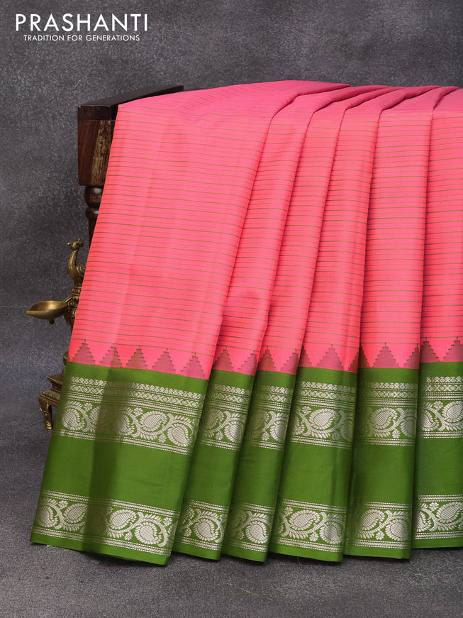 Pure gadwal silk saree peach pink and sap green with allover stripes pattern and temple design rettapet silver zari woven border