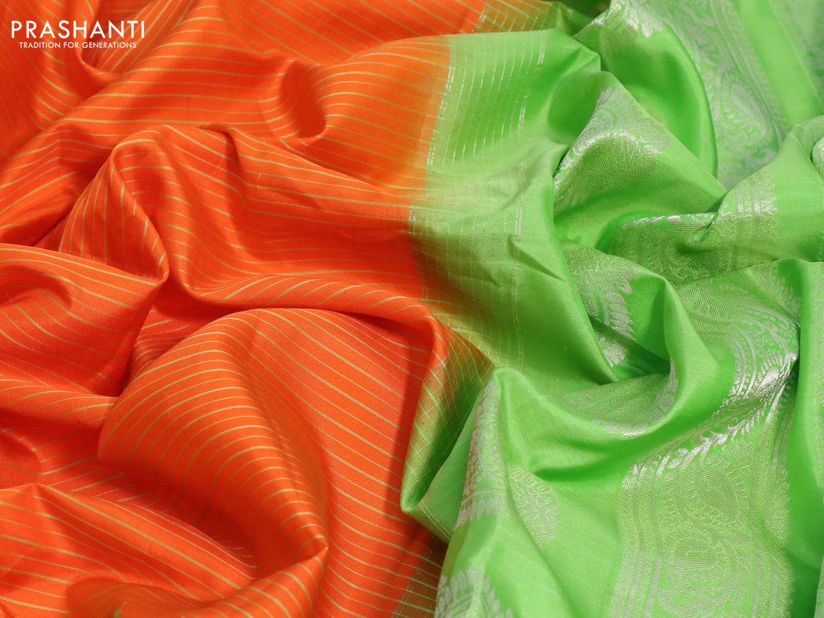 Pure gadwal silk saree orange and light green with allover stripes pattern and temple design rettapet silver zari woven border