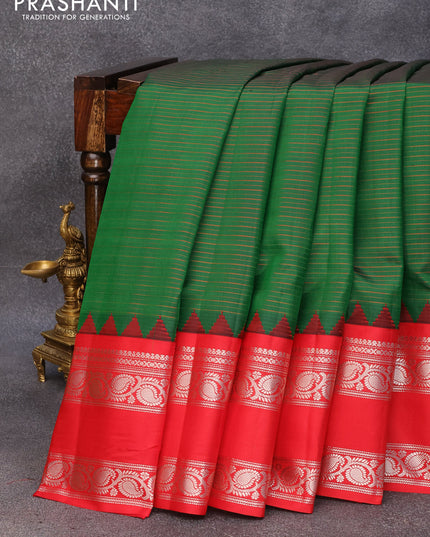 Pure gadwal silk saree green and red with allover stripes pattern and temple woven rettapet silver zari woven border