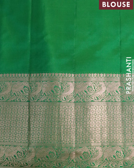 Pure gadwal silk saree dual shade of yellowish pink and green with zari woven buttas and temple design zari woven border