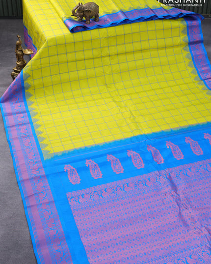Pure gadwal silk saree lime yellow and cs blue with allover checked pattern and temple design thread woven border