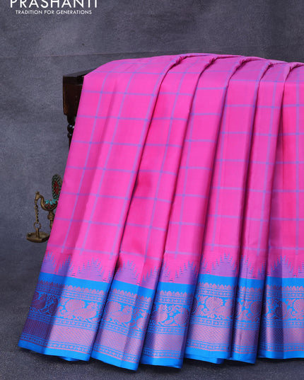 Pure gadwal silk saree light pink and cs blue with allover checked pattern and temple design thread woven border