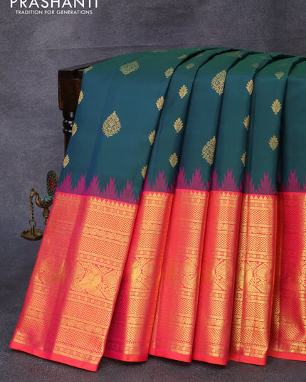 Pure gadwal silk saree peacock green and dual shade of pinkish orange with allover zari woven floral buttas and temple design long zari woven border