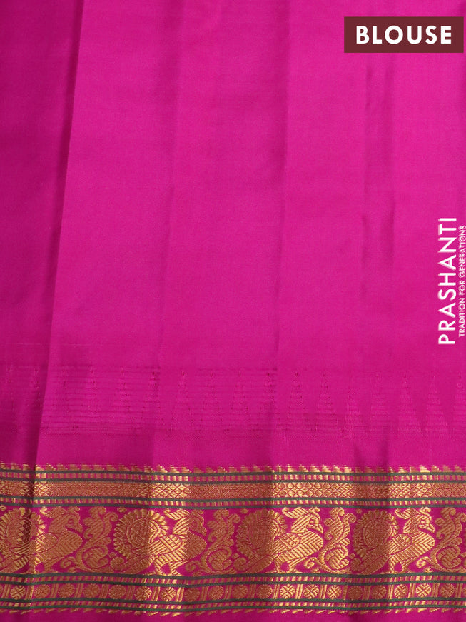 Pure gadwal silk saree blue and pink with allover zari woven floral buttas and temple design annam zari woven border
