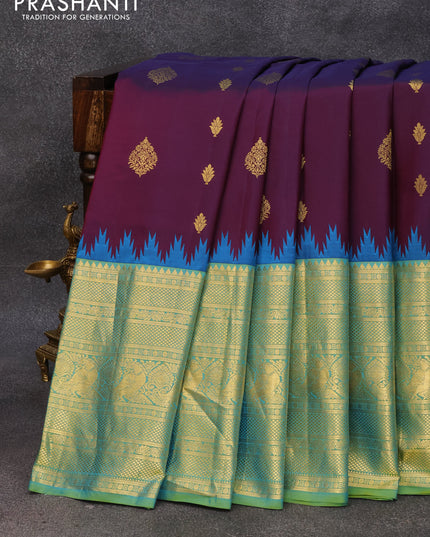 Pure gadwal silk saree deep jamun shade and dual shade of teal blue with zari woven buttas and long annam zari woven border