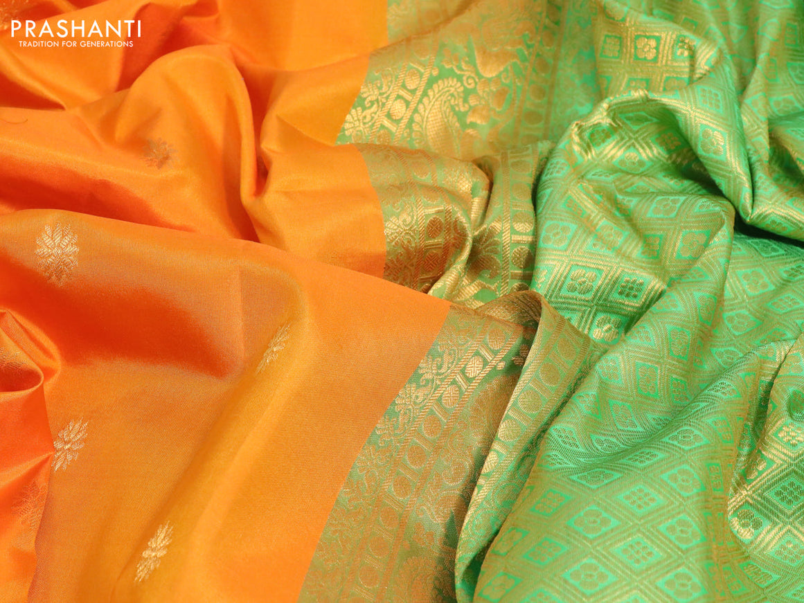 Pure gadwal silk saree orange and light green with zari woven floral buttas and temple design annam zari woven border