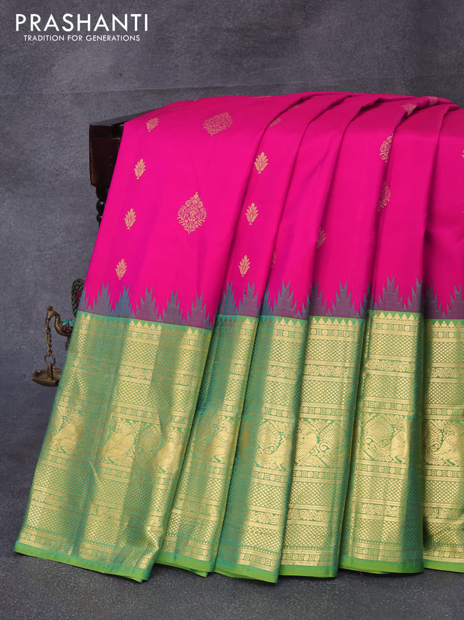 Pure gadwal silk saree pink and green shade with zari woven floral buttas and temple design long zari woven border