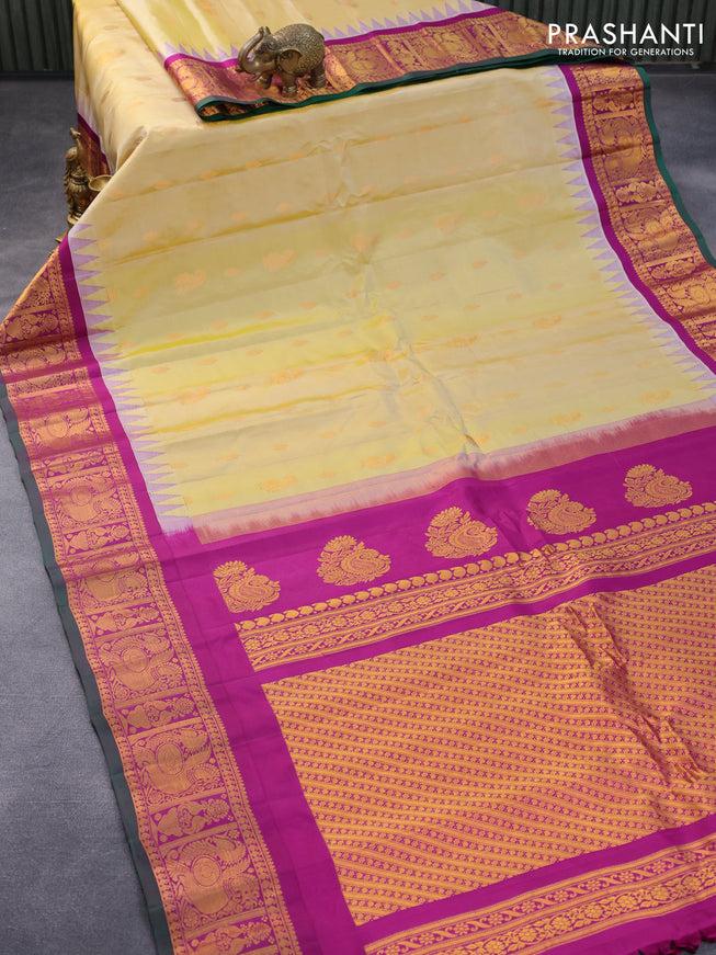Pure gadwal silk saree pale yellow and purple with zari woven buttas and temple design annam zari woven border