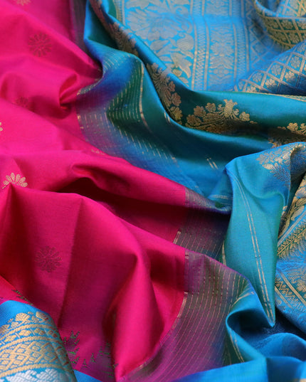 Pure gadwal silk saree dual shade of pink and dual shade of cs blue with zari woven floral buttas and temple design long zari woven border
