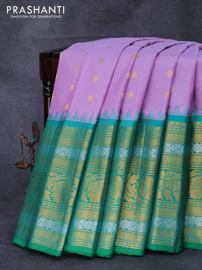 Pure gadwal silk saree pastel lavender and green with zari woven floral buttas and temple design zari woven border
